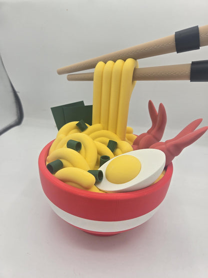 Ramen Bowl Display and Stash 3D print close-up of the noodle topper with chopsticks, green onion pieces, seaweed sheets, shrimp and a halved soft-boiled egg