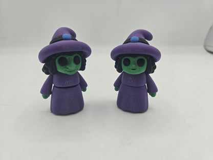 Tiny Witch Articulated Flexi Mini 3D print both nose styles standing upright on a white surface, front view in purple and green