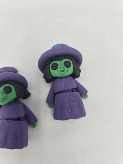 Tiny Witch Articulated Flexi Mini 3D print close-up of the regular-nose witch, articulated body with purple robe segments and green hands