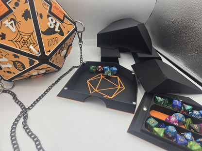 D20 Dice Shaped Purse 3D print in orange Halloween design next to the black TTRPG organizer insert: dice rolling tray with orange D20 outline, dice tower and a holder tray full of polyhedral dice