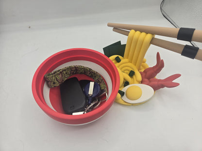 Ramen Bowl Display and Stash 3D print opened with car keys and a keychain stored inside the red bowl, noodle topper lid set to the side