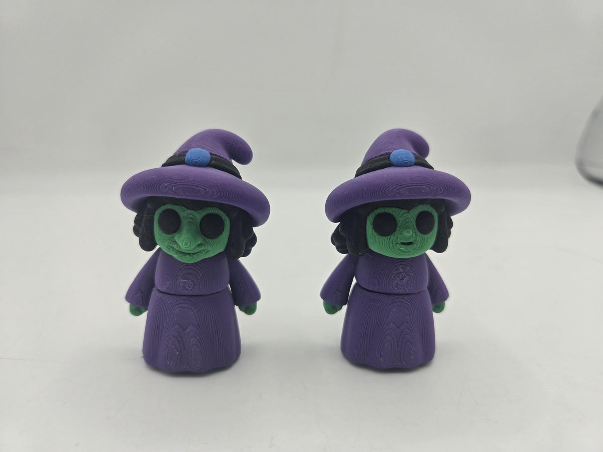 Tiny Witch Articulated Flexi Mini 3D print, two styles side by side: long storybook witch nose on the left and regular cute nose on the right, both with purple hats and robes and green skin