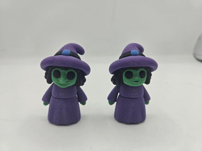 Tiny Witch Articulated Flexi Mini 3D print, two styles side by side: long storybook witch nose on the left and regular cute nose on the right, both with purple hats and robes and green skin