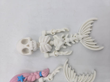 Flexi Mermaid Skeleton 3D print close-up of the plain white style showing hollow-eyed skull, ribcage, hinged arm joints and bony mermaid tail