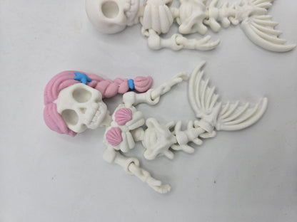 Flexi Mermaid Skeleton 3D print close-up of the Hair + Clam Shells style with pink braided hair, blue starfish hair clip, pink seashell top and jointed spine
