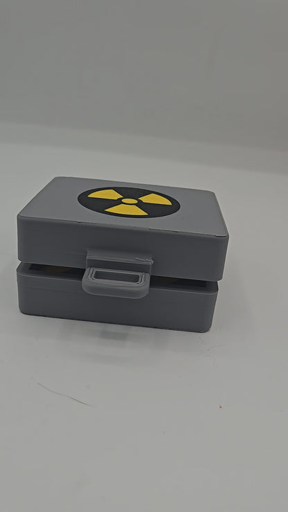 Top Secret Briefcase Nuclear Mechanical Key Fidget Clicker 3D print video — gray briefcase with radiation symbol lid and latch, opened to reveal the red NUKE clicker button