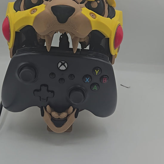 Video of the Mekachu Mecha Monster controller holder 3D print, a mecha-armored creature head with an opening jaw designed to hold a gaming controller on display