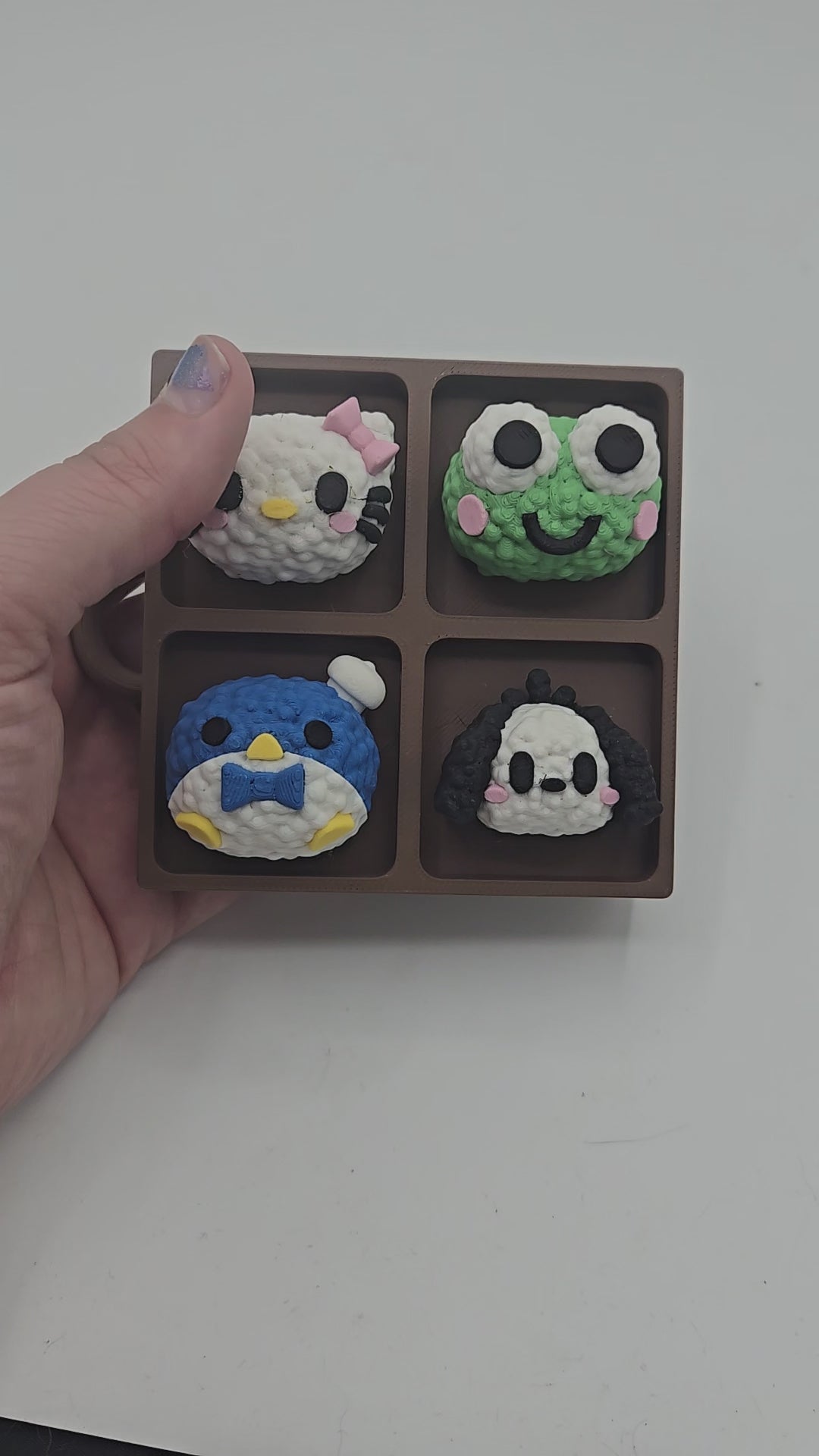 Video of the Sanrio themed rice ball tray clicker fidget — pressing the kawaii rice ball characters to sound their mechanical key switches, 3D printed